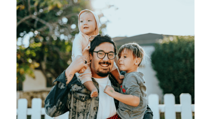 Life Insurance dad with glasses and kids protecting his family